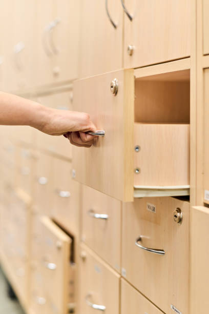 istock Pharmacist hand opening wooden drawer in pharmacy storage 2200013794