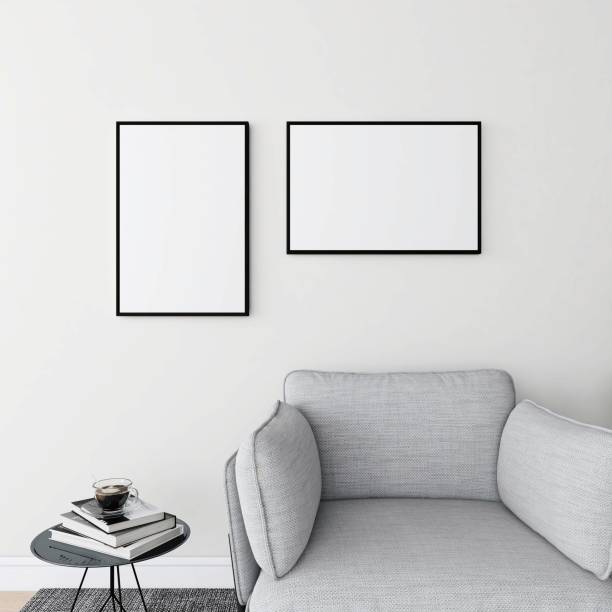 istock Living room with a mockup of a vertical and a horizontal frame, gray sofa and decorated table 2200014039