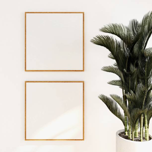 istock Mockup of two blank square frames next to an ornamental plant 2200014184