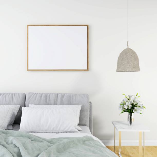 istock Bedroom with a blank horizontal frame mockup, a gray bed, a table with a flower vase and a ceiling lamp 2200014199