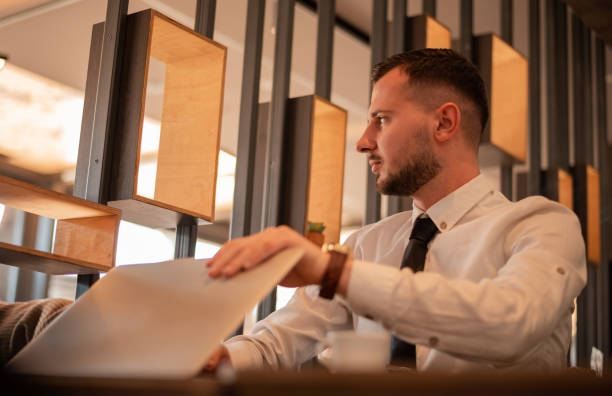 istock Young business man working on a laptop at office. 2200016557
