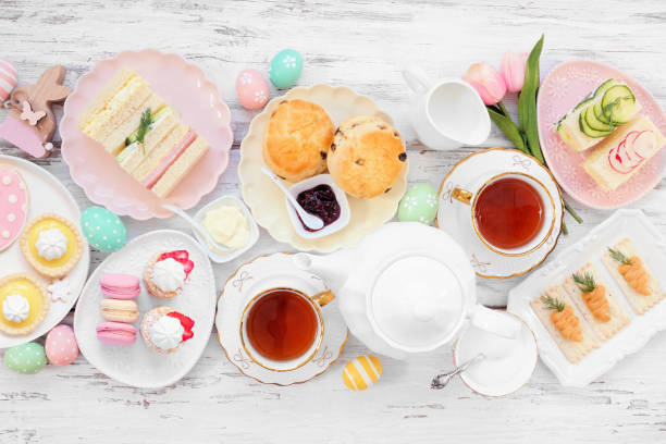 istock Easter or spring tea table scene against a white wood background 2200017112