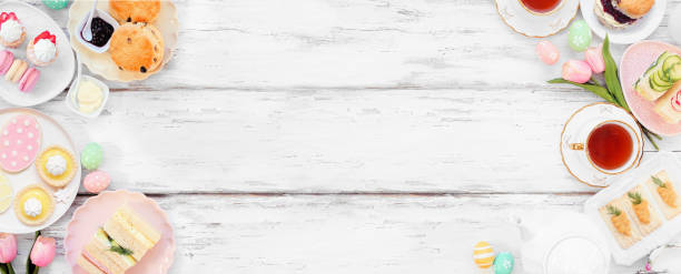 istock Easter or spring tea double border against a white wood banner background 2200017119