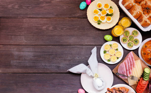 istock Easter breakfast or brunch side border. Above view on a dark wood background. 2200017154