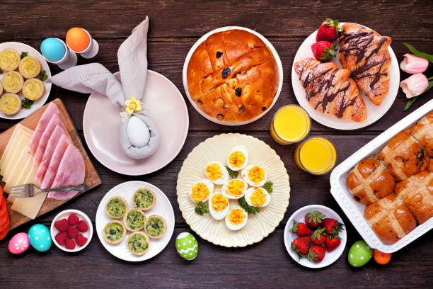 istock Easter breakfast or brunch table scene. Top view on a dark wood background. 2200017161