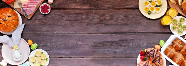 istock Easter breakfast or brunch double border. Top view on a dark wood banner background. 2200017168