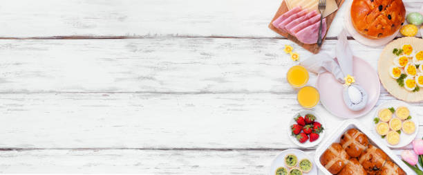 istock Easter breakfast or brunch side border. Above view on a white wood banner background. 2200017239