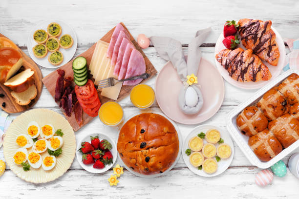 istock Easter breakfast or brunch table scene. Top view on a white wood background. 2200017240