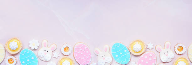 istock Easter or spring themed baking bottom border on a pink stone banner background 2200017290