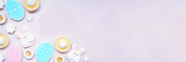 istock Easter or spring themed baking corner border on a pink stone banner background 2200017343
