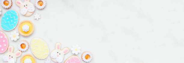 istock Easter or spring themed baking corner border on a white marble banner background 2200018153