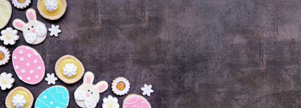 istock Easter or spring themed baking corner border on a dark stone background 2200018395