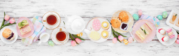 istock Easter or spring tea table scene against a white wood banner background 2200018795