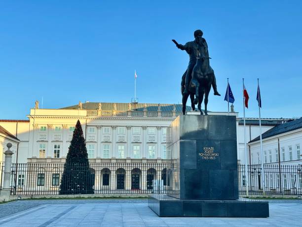 view of a statue in front of the presidential palace in warsaw on a sunny winter day