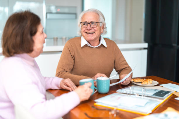 istock Senior Hispanic Couple Managing Finances Over Tea 2200023010