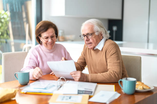 istock Senior Hispanic Couple Organizing Home Finances Together 2200023012