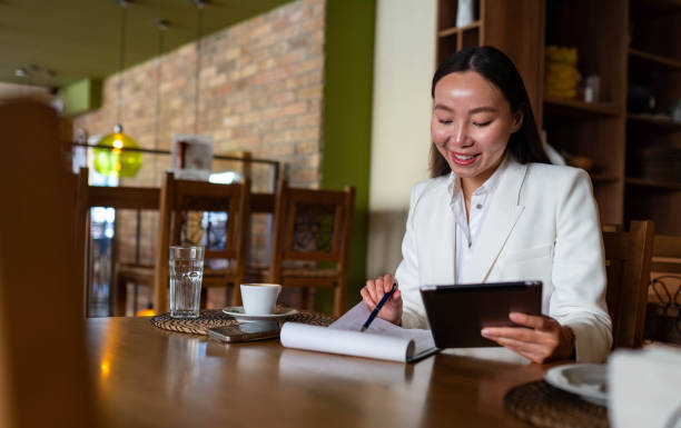 istock Successful businesswoman using laptop 2200029573