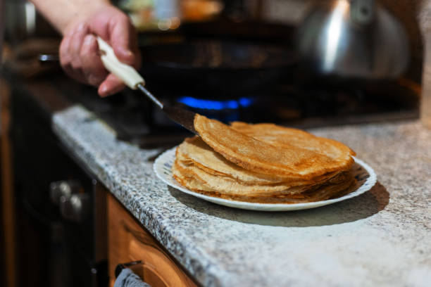 istock Baking delicious thin pancakes, cooking process. Delicious breakfast. 2200033570