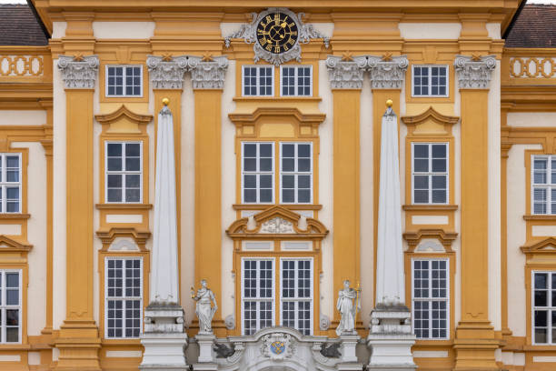 Melk, Austria - February 24, 2023: Decorative facade of Melk Abbey on hill above town. It was founded in 11th century, today's baroque abbey was built in 18th century