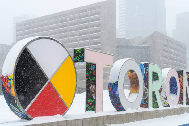 Toronto, Canada - February 16, 2025: Part of the three dimensional sign in Nathan Phillips Square during a snow storm.