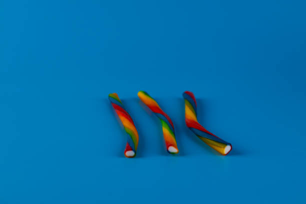 Colorful lollipop on white background, closeup of photo