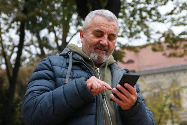 istock Senior man waiting lovely message from woman 2200048952