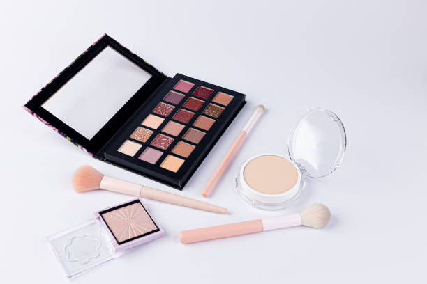 istock A Beautiful Array of Makeup Essentials Featuring an Eye Shadow Palette, Foundation, and Makeup Brushes for Ultimate Beauty Looks and Techniques 2200049895
