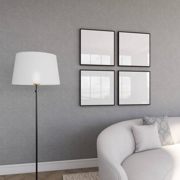istock Living room with four square frame mockups on a gray wall and interior decoration 2200051260