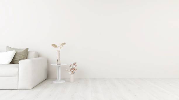 istock Wall mockup in a harmonious living room, sofa with pillows and ornamental plants 2200051373