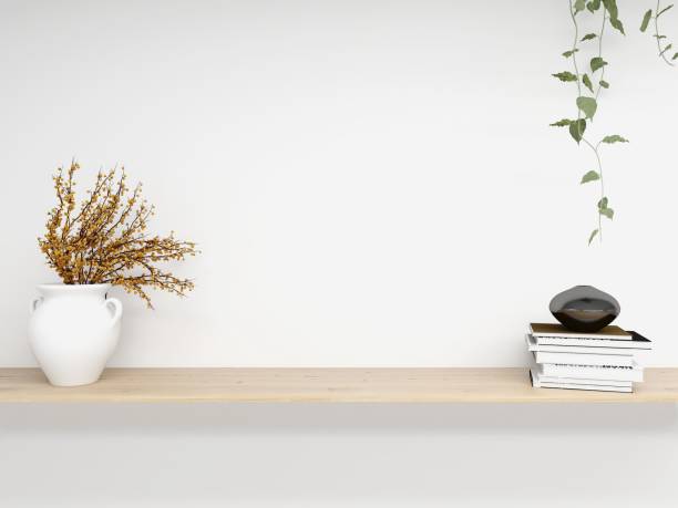 istock White wall mockup with ornamental plants, books and table decorations 2200051426