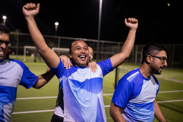 istock Soccer Players Celebrating Win After Game 2200051950