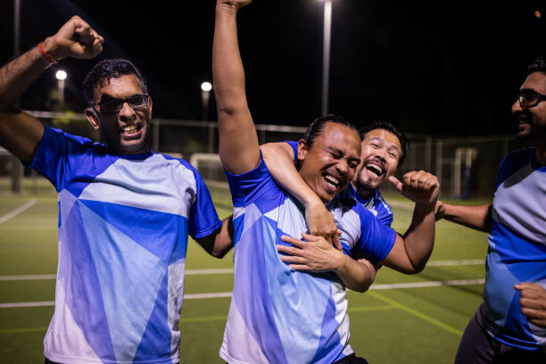 istock Soccer Players Celebrating Win After Game 2200052516