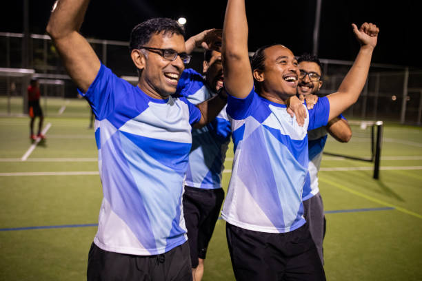 istock Soccer Players Enjoying Post-Match Victory Celebration 2200052715