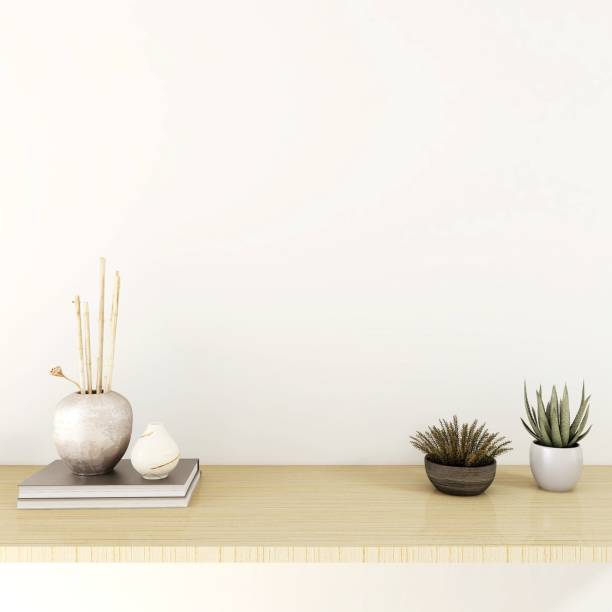 istock Wall mockup with ornamental plants, decorations and books 2200052724