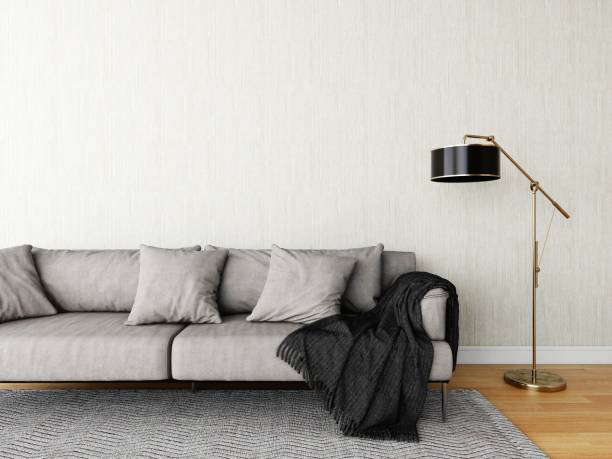istock Wall mockup of a beige wall and a gray sofa 2200052777