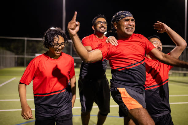 istock Soccer Players Celebrating Victory 2200053015