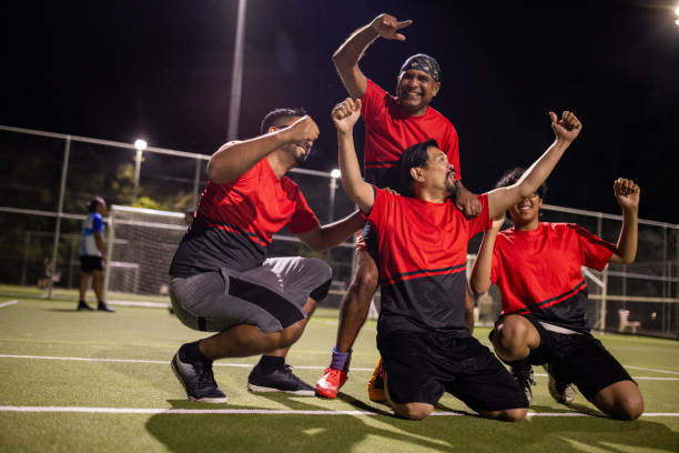 istock Soccer Team Celebrating a Goal 2200053153