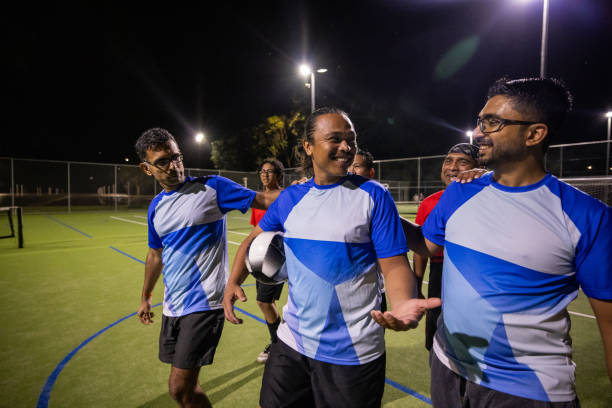 istock Soccer Players Walking Off the Pitch After a Challenging Game 2200054437