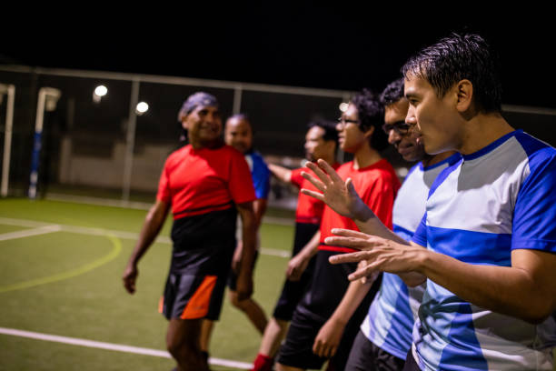 istock Soccer Teams Walking Off the Field After a Competitive Match 2200054635