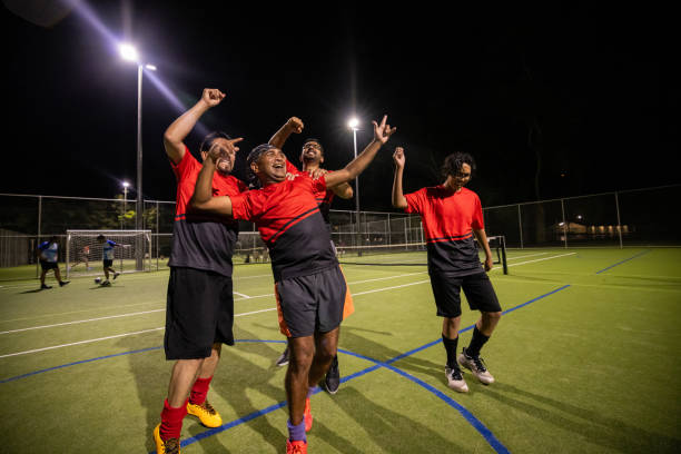 istock Soccer Players Celebrating a Goal Together 2200055334