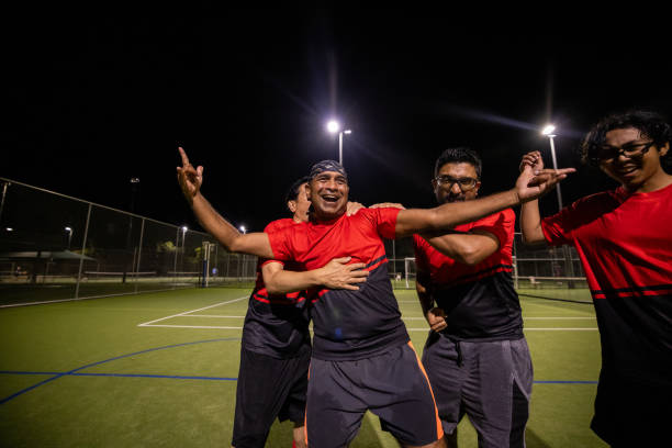 istock Soccer Players Celebrating a Goal Together 2200055405