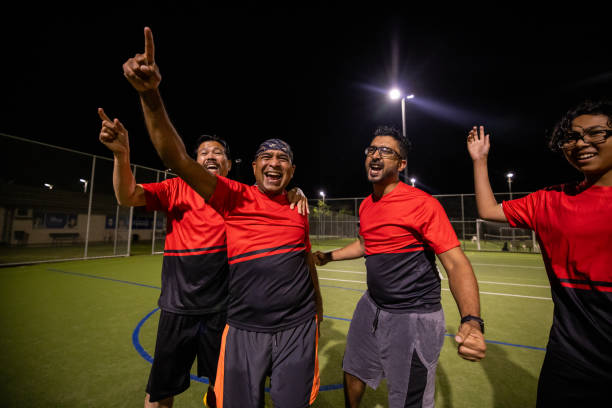 istock Soccer Players Celebrating a Goal Together 2200055449