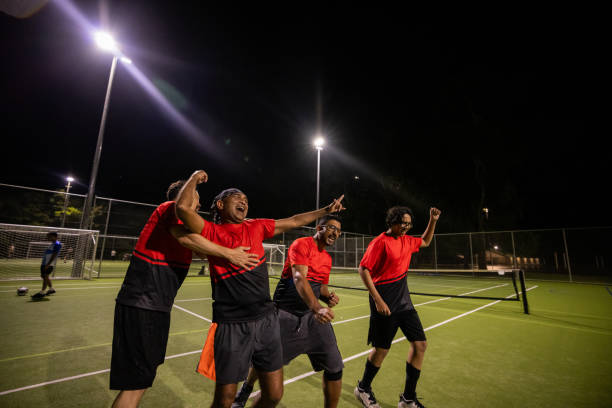 istock Soccer Players Celebrating a Goal Together 2200055472