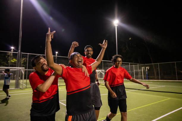istock Joyful Soccer Team Celebrating Victory on the Pitch 2200055561