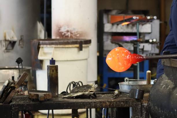 istock Glass blowing technique to shape a bowl from hot glass 2200055766