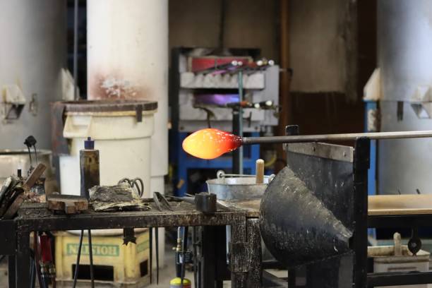 istock Glass blowing technique to shape a bowl from hot glass 2200055767