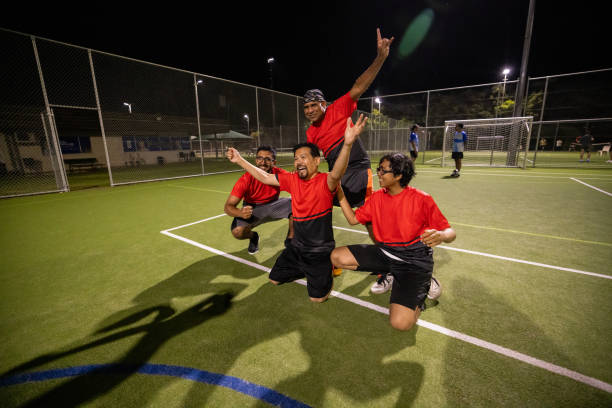 istock Joyful Soccer Team Celebrating Victory on the Pitch 2200055818