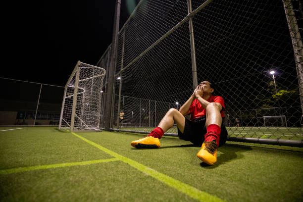 istock Frustrated Soccer Player After a Lost Match 2200055989