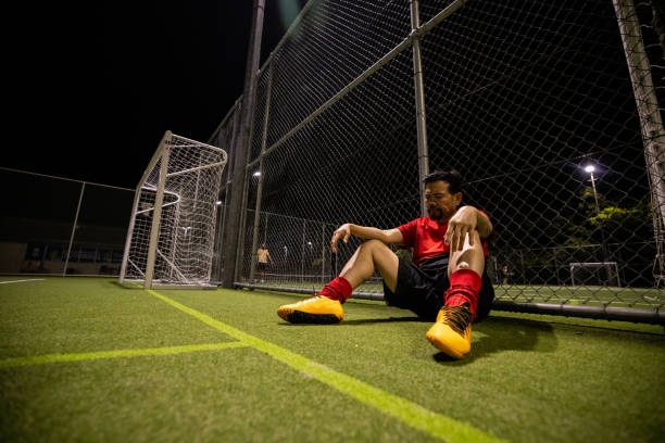 istock Frustrated Soccer Player After a Lost Match 2200056156