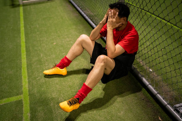istock Frustrated Soccer Player After a Lost Match 2200056207